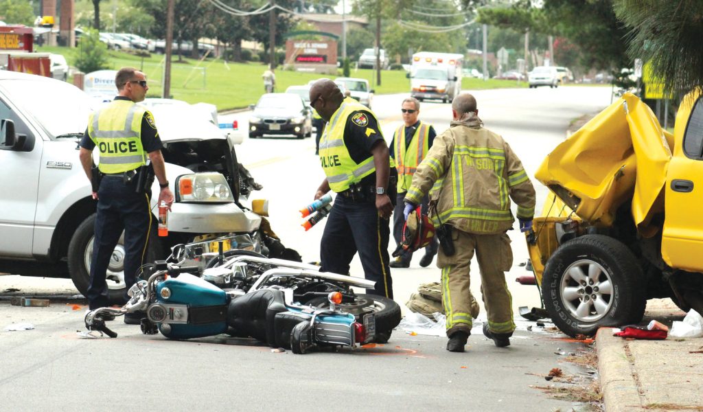 Wilson Fire/Rescue Services personnel assist drivers involved in a three-vehicle wreck that sent two to the hospital with serious  injuries Wednesday.. A Ford F-150 pickup, a Dodge Pickup and a motorcycle were involved. The driver of the motorcycle and the Dodge were taken the hospital with serious injuries. The wreck happened between Canal and Charles Streets on Herring Avenue before 4 p.m. Wilson Police is investigating. Photo taken Wednesday, Aug. 9, 2017. Drew C. Wilson | Times